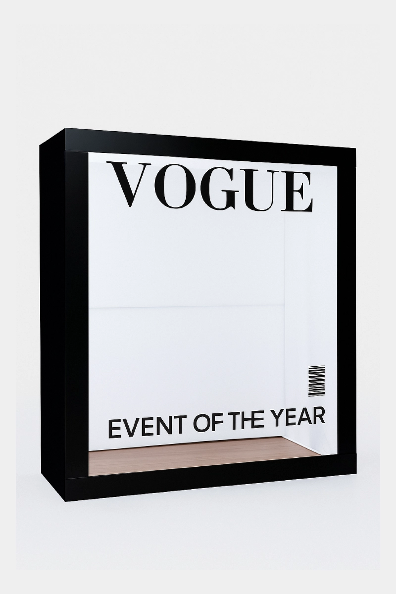 Magazine cover-style booth with customizable graphics and white backdrop.